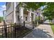 Townhome exterior with fenced yard, showcasing double balconies and modern design at 1434 Fairmont Ave, Atlanta, GA 30318