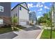 Modern homes with two-car garages showcasing manicured landscaping and neighborhood street views at 1434 Fairmont Ave, Atlanta, GA 30318