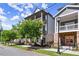 Modern townhome featuring double balconies, street view with manicured landscaping at 1434 Fairmont Ave, Atlanta, GA 30318