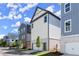 Stylish three-story home showcasing modern architecture, a two car garage, and manicured landscaping at 1434 Fairmont Ave, Atlanta, GA 30318