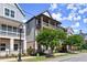 Street view of a modern townhome featuring double balconies and well-maintained landscaping at 1434 Fairmont Ave, Atlanta, GA 30318