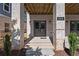 Inviting front porch featuring a modern entrance with stylish lighting and brick accents at 1434 Fairmont Ave, Atlanta, GA 30318