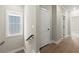 Upstairs hallway with wood floors, a window, and doors to other rooms at 1434 Fairmont Ave, Atlanta, GA 30318