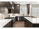 This modern kitchen features stainless steel appliances, white countertops, and sleek dark cabinets at 1434 Fairmont Ave, Atlanta, GA 30318