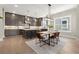 Open kitchen with stainless steel appliances, island seating, and a dining area nearby at 1434 Fairmont Ave, Atlanta, GA 30318