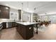 This spacious kitchen has an island with seating and stainless appliances, and is open to the living room at 1434 Fairmont Ave, Atlanta, GA 30318