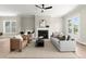 Open-concept living room with fireplace, neutral decor, and hardwood floors at 1434 Fairmont Ave, Atlanta, GA 30318