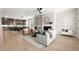 Bright living room and open kitchen with modern decor, fireplace and hardwood floors at 1434 Fairmont Ave, Atlanta, GA 30318