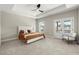Bright main bedroom with a tray ceiling, ceiling fan, and access to a balcony at 1434 Fairmont Ave, Atlanta, GA 30318