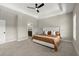 Spacious main bedroom with a tray ceiling, ceiling fan, and carpeted floors in a modern style at 1434 Fairmont Ave, Atlanta, GA 30318