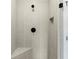 Modern tiled shower features a built-in bench, matte black hardware, and a tiled shampoo niche at 1434 Fairmont Ave, Atlanta, GA 30318