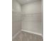 An empty walk-in closet featuring wire shelving for ample storage space and neutral carpeting at 1434 Fairmont Ave, Atlanta, GA 30318
