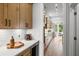 Convenient butler's pantry equipped with custom cabinetry, wine storage, and ample counter space at 313 Brooke View Trl, Canton, GA 30115