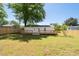 Large backyard with a wooden deck and a new privacy fence at 1045 Ridgecrest Se Dr, Smyrna, GA 30080