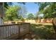 Backyard view featuring a wooden deck and a spacious, green lawn at 1045 Ridgecrest Se Dr, Smyrna, GA 30080