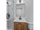 Bathroom featuring a vanity, stylish mirror and a glass shower enclosure at 1045 Ridgecrest Se Dr, Smyrna, GA 30080