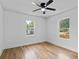 Bedroom featuring hardwood flooring, ceiling fan and windows offering natural light at 1045 Ridgecrest Se Dr, Smyrna, GA 30080