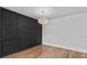 Chic dining space with custom wall trim, modern lighting, and hardwood floors at 1045 Ridgecrest Se Dr, Smyrna, GA 30080