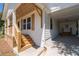 Close up of the home's covered port and wooden porch with newly stained lumber at 1045 Ridgecrest Se Dr, Smyrna, GA 30080