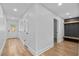 Hallway featuring hardwood floors and coat rack at 1045 Ridgecrest Se Dr, Smyrna, GA 30080