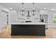 Bright, open kitchen showcasing a large island, modern appliances, and sleek countertops for culinary enthusiasts at 1045 Ridgecrest Se Dr, Smyrna, GA 30080