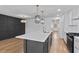Stunning updated kitchen with stainless appliances, waterfall quartz counters, and an adjacent dining area at 1045 Ridgecrest Se Dr, Smyrna, GA 30080