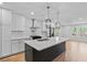 Spacious kitchen featuring new cabinets, stainless appliances, and a stylish island, perfect for entertaining at 1045 Ridgecrest Se Dr, Smyrna, GA 30080