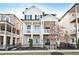 Charming two-story home featuring stone accents, a welcoming porch, a fenced yard, and classic black shutters at 1436 Fairmont Nw Ave, Atlanta, GA 30318