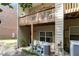 Exterior view of a back porch with comfortable seating and a glimpse of the well-maintained backyard at 1976 Cobblestone Ne Cir, Atlanta, GA 30319