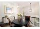 Upstairs dining area with table and chairs, hardwood floors, and view of the stairs at 1976 Cobblestone Ne Cir, Atlanta, GA 30319