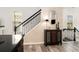 Elegant entryway featuring hardwood floors, a staircase, and a decorative table at 1976 Cobblestone Ne Cir, Atlanta, GA 30319