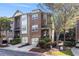 Charming brick townhome with a two-car garage and lovely landscaping at 1976 Cobblestone Ne Cir, Atlanta, GA 30319