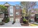 Charming brick townhome with a two-car garage and lovely landscaping at 1976 Cobblestone Ne Cir, Atlanta, GA 30319