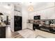 Bright kitchen features white cabinets, black countertops, stainless steel appliances, and modern lighting at 1976 Cobblestone Ne Cir, Atlanta, GA 30319