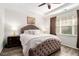 Inviting bedroom featuring a tray ceiling, plush bedding, neutral color scheme, and modern decor at 1976 Cobblestone Ne Cir, Atlanta, GA 30319