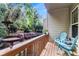 Cozy porch with seating and a view of the landscaped backyard, perfect for relaxation at 1976 Cobblestone Ne Cir, Atlanta, GA 30319