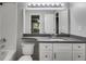 Bathroom with a white vanity, stone counters, and a well-lit mirror at 2901 Ne Lenox Rd # 305, Atlanta, GA 30324