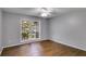Cozy bedroom featuring warm hardwood floors and a bright window with natural light at 2901 Ne Lenox Rd # 305, Atlanta, GA 30324