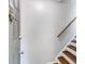 Welcoming entryway with wood stairs and railing, offering a glimpse of the home's interior at 2901 Ne Lenox Rd # 305, Atlanta, GA 30324