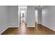 Inviting hallway with wood floors leading to a well-lit bathroom at 2901 Ne Lenox Rd # 305, Atlanta, GA 30324