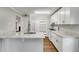 Bright kitchen featuring white cabinets, marble countertops, and stainless steel appliances at 2901 Ne Lenox Rd # 305, Atlanta, GA 30324