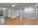 Expansive living room with hardwood floors, multiple entryways, and ample natural light at 2901 Ne Lenox Rd # 305, Atlanta, GA 30324