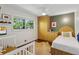Charming bedroom featuring hardwood floors, natural light, built-in wardrobe, and a small bed at 2029 Dover Hill Ne Pl, Atlanta, GA 30345