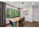 This dining room has plenty of natural light, dark curtains, and modern lighting fixtures at 2029 Dover Hill Ne Pl, Atlanta, GA 30345