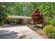 Charming brick home featuring a convenient carport and a well-manicured front yard with a red Japanese maple at 2029 Dover Hill Ne Pl, Atlanta, GA 30345