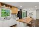 Bright kitchen features wooden island, marble countertops, a sink with a view, and stainless steel appliances at 2029 Dover Hill Ne Pl, Atlanta, GA 30345