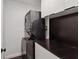 Efficient laundry area with a stacked washer and dryer unit, complemented by sleek countertop space for folding at 2029 Dover Hill Ne Pl, Atlanta, GA 30345