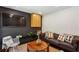 Modern living room with a dark accent wall, flat-screen TV, and comfortable seating for entertaining guests at 2029 Dover Hill Ne Pl, Atlanta, GA 30345