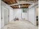 Spacious unfinished basement with potential for storage, recreation, or future renovation with a window for natural light at 2029 Dover Hill Ne Pl, Atlanta, GA 30345