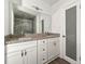 Bright bathroom featuring double vanity, granite countertops, and modern fixtures at 2254 Lisbon Ln, Jonesboro, GA 30236